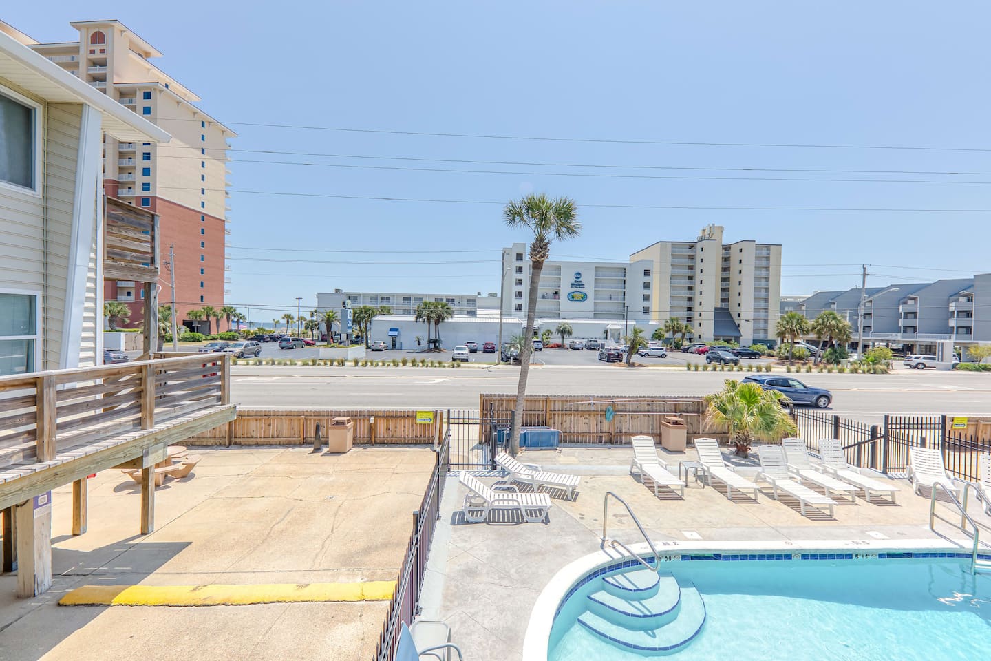 Exterior Poolside Retreat: Dive into relaxation with sun-kissed lounging by the sparkling pool!