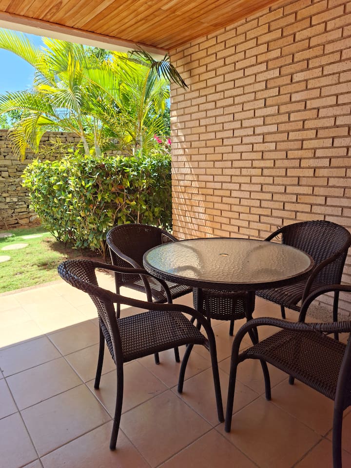 Enjoy a meal under the sun with a comfortable outdoor dining setup.