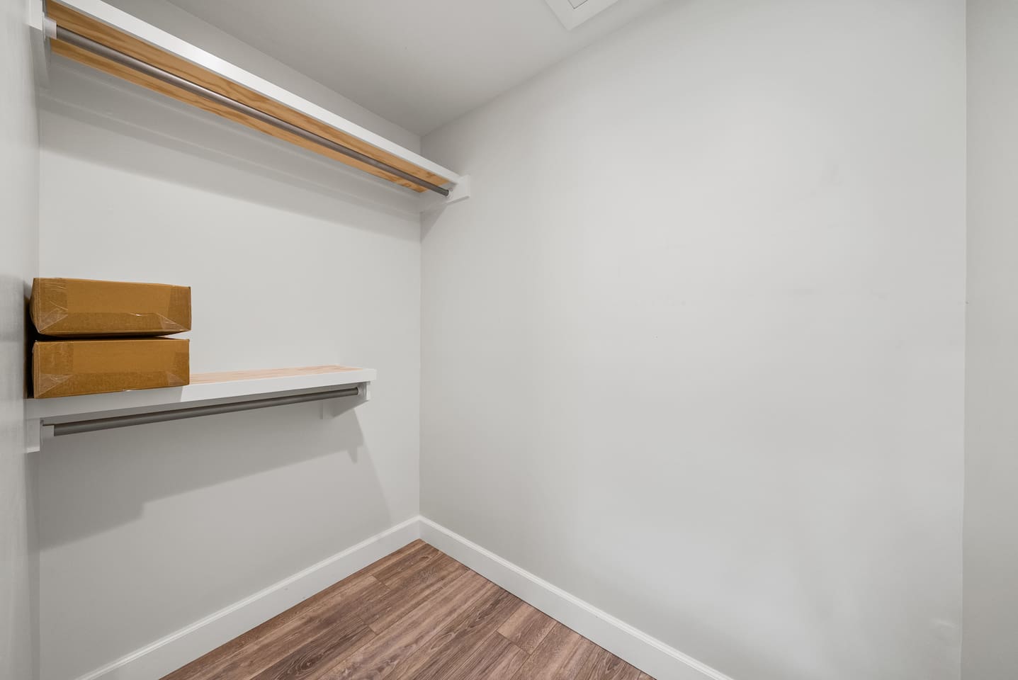Walk in closet of the master bedroom of Unit B. 