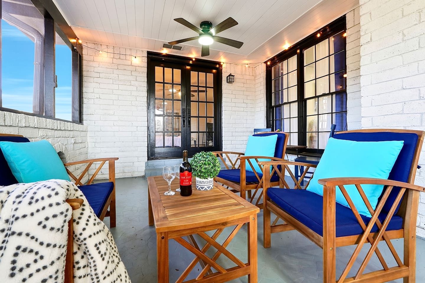 Inviting and spacious sunroom featuring ample seating, perfect for relaxing, unwinding, or spending quality time together.