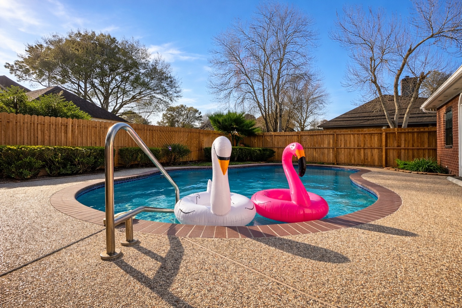 Enjoy sunny pool days in this fully fenced backyard retreat with comfortable outdoor seating and plenty of space to unwind