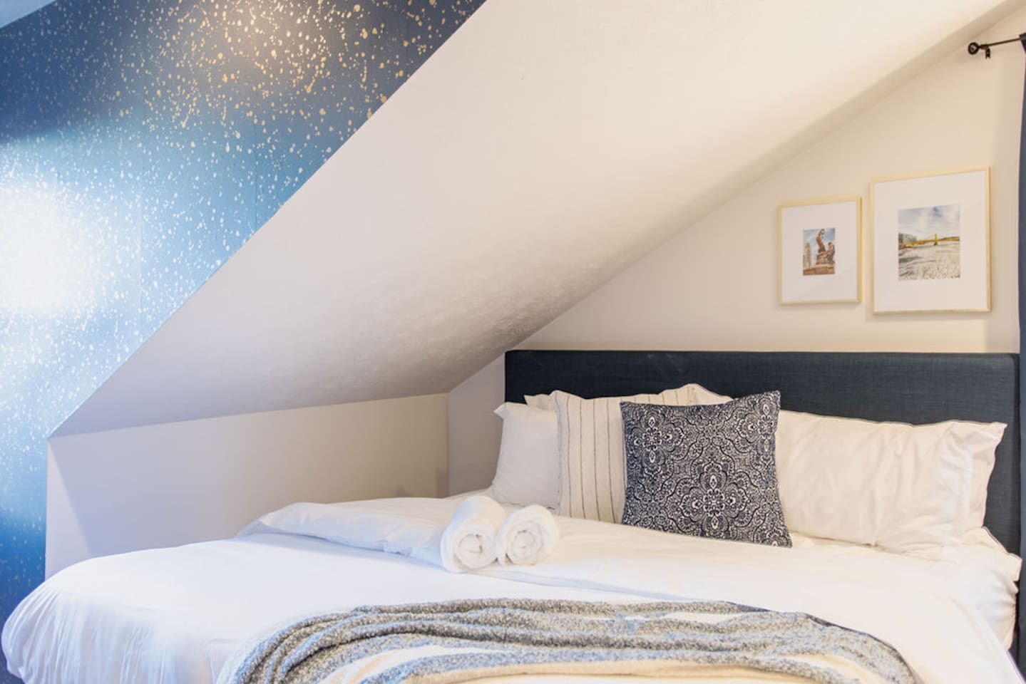 Spacious bedroom featuring two king beds, offering ample comfort and plenty of space for families or groups looking to relax together.