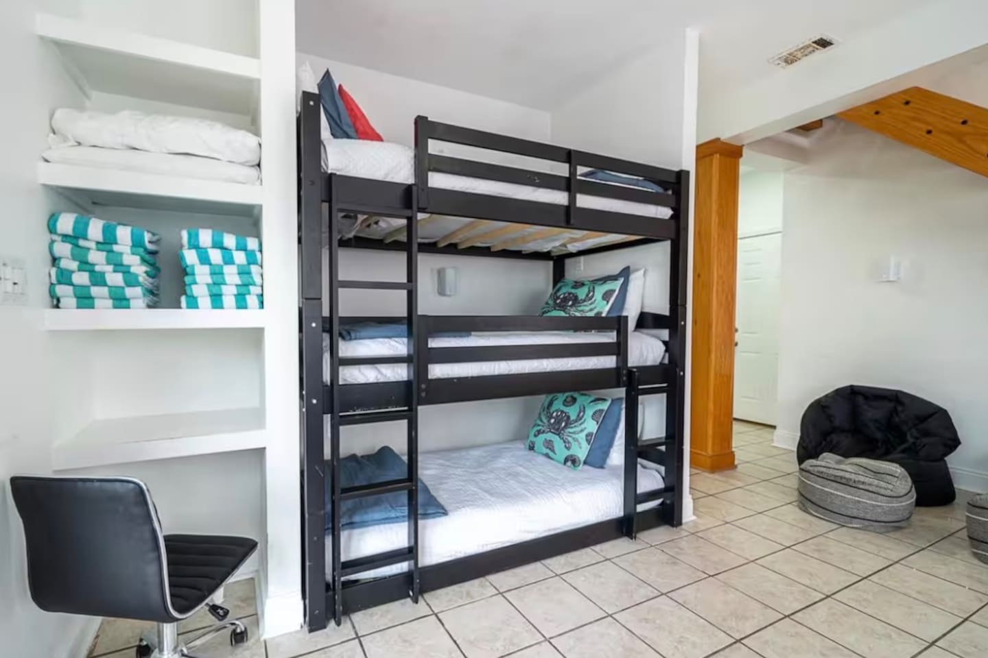 Three bunk beds on bottom floor