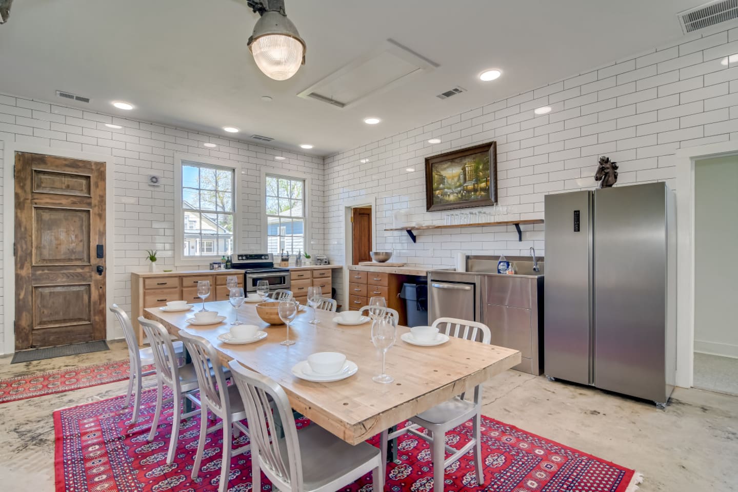 Dining hall with long table, perfect for group meals and celebrations.