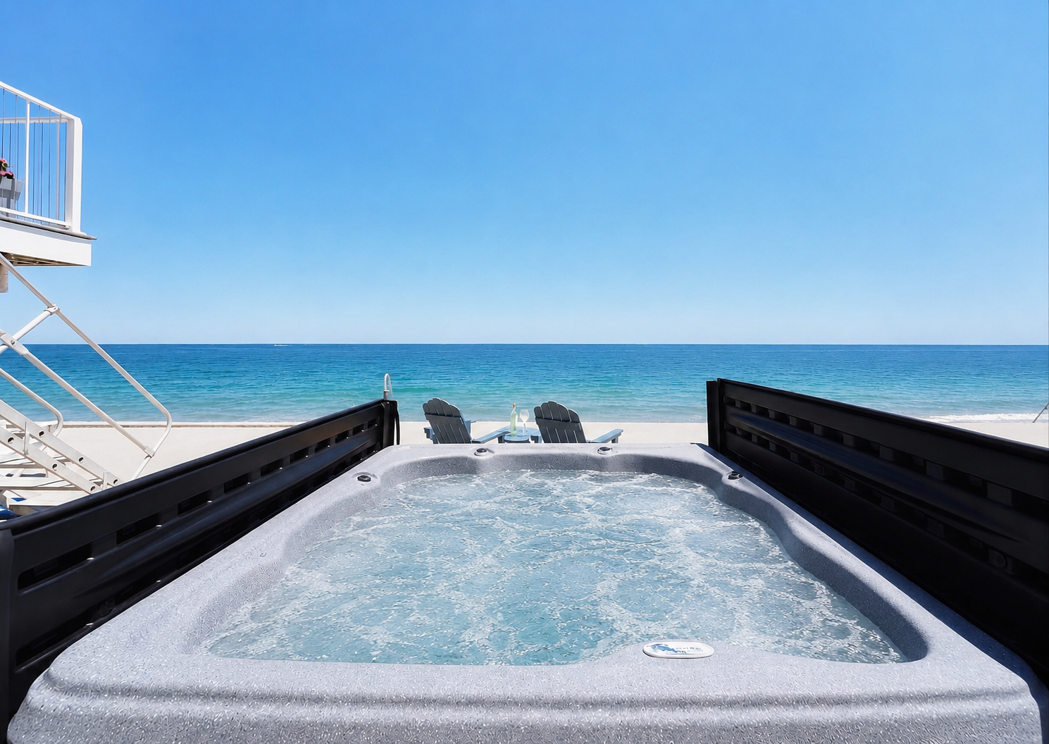 Unwind in the private hot tub while taking in sweeping ocean views.