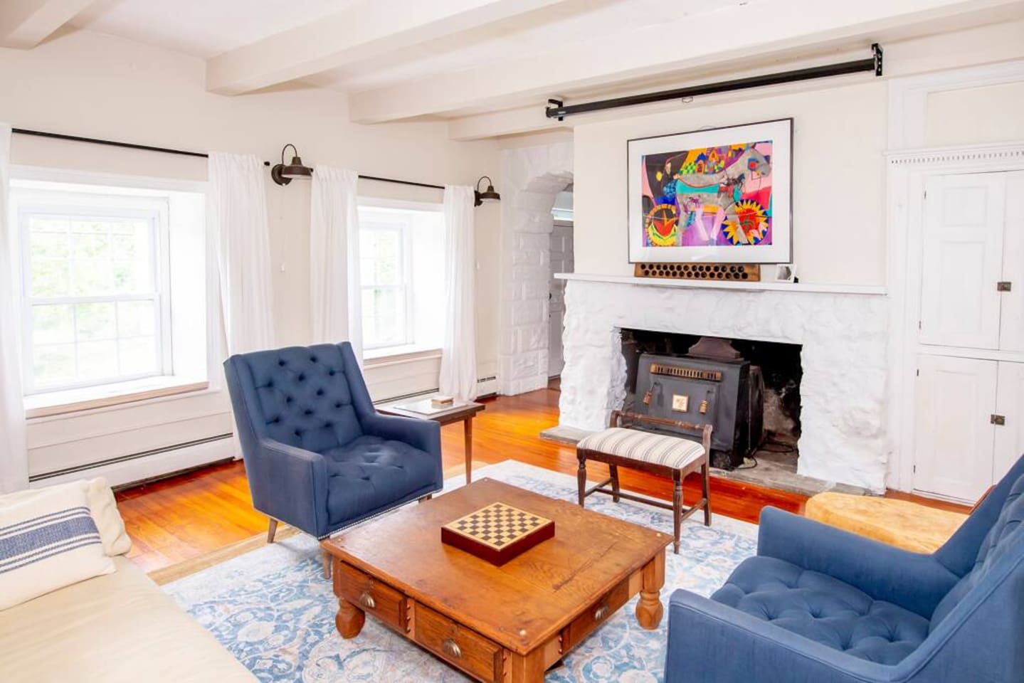 Living room with original stone fireplace