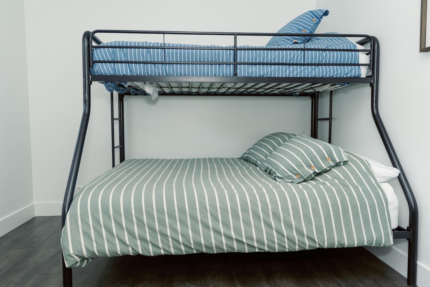 Bunk beds in third bed, full size bottom with a twin on top.