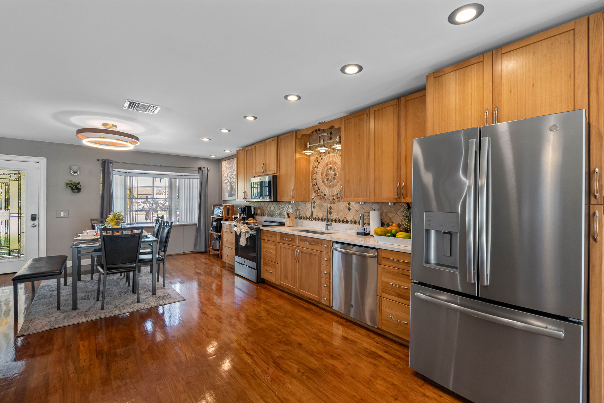 With ample cabinetry, built-in storage, and additional shelving for small appliances, this kitchen keeps everything neatly in place.