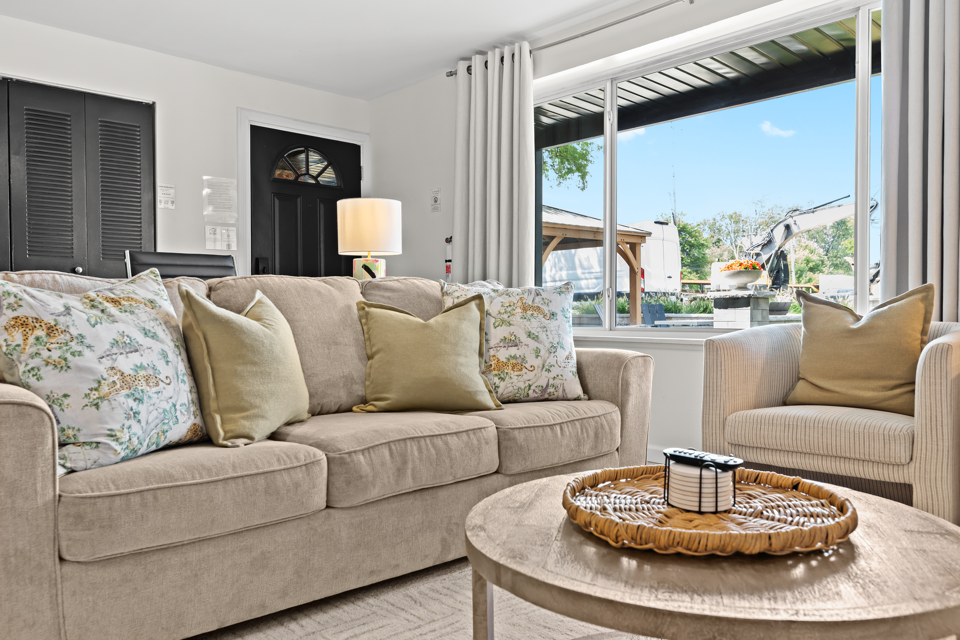 Modern layout with dual sofas and large windows—ideal for group gatherings or a quiet evening in.