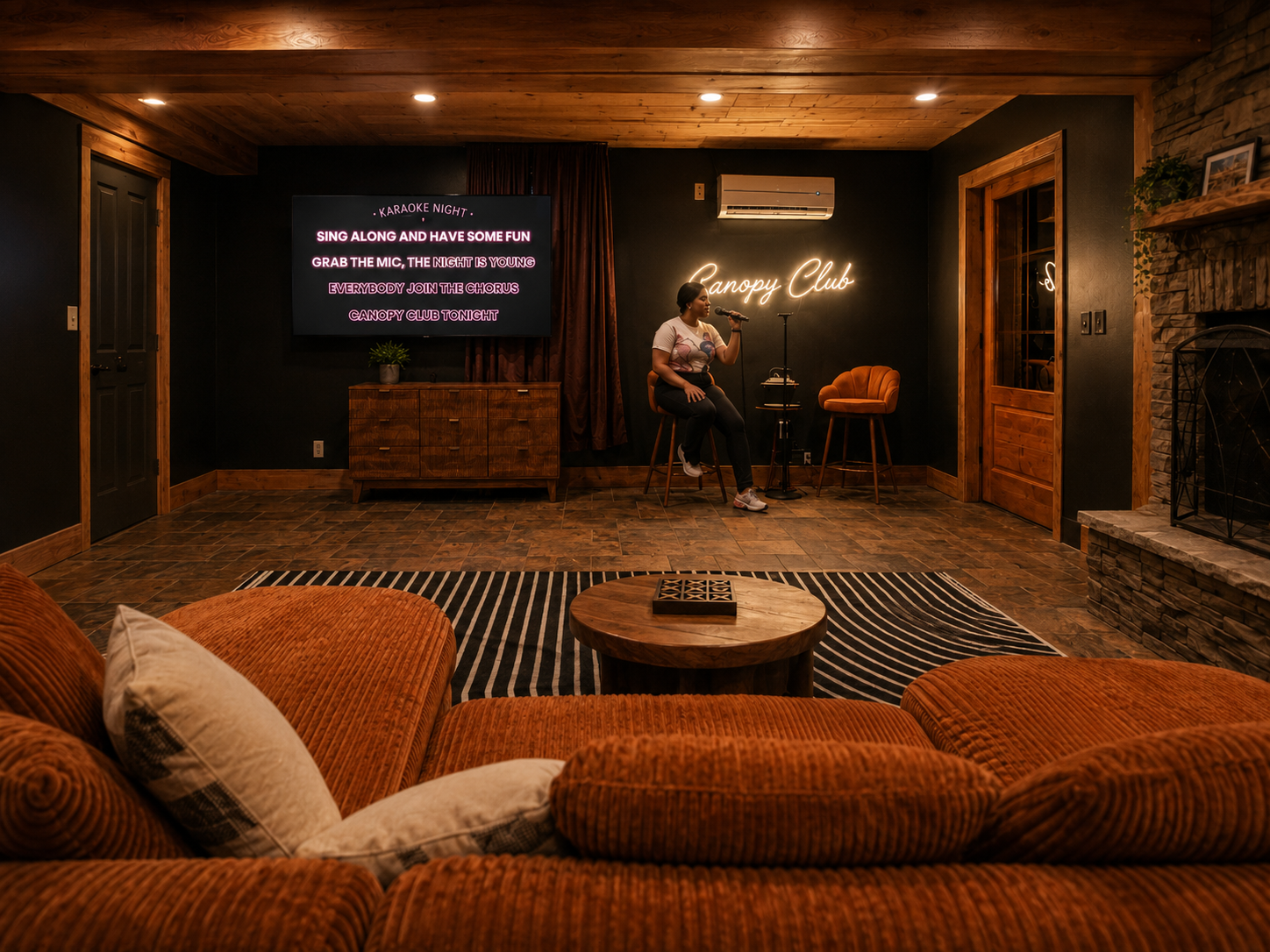 {Canopy Club Karaoke Lounge} Grab the mic, choose your favorite song, and settle in for a cozy karaoke night complete with fireside seating, oversized sectional lounging, and games around the coffee table.