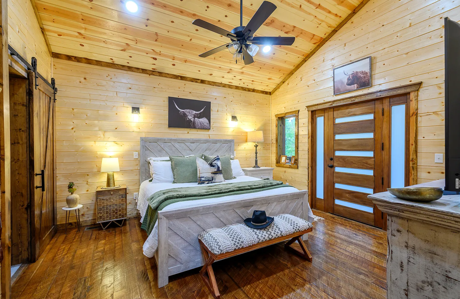 Cozy master bedroom with warm wood interiors and relaxing cabin ambiance