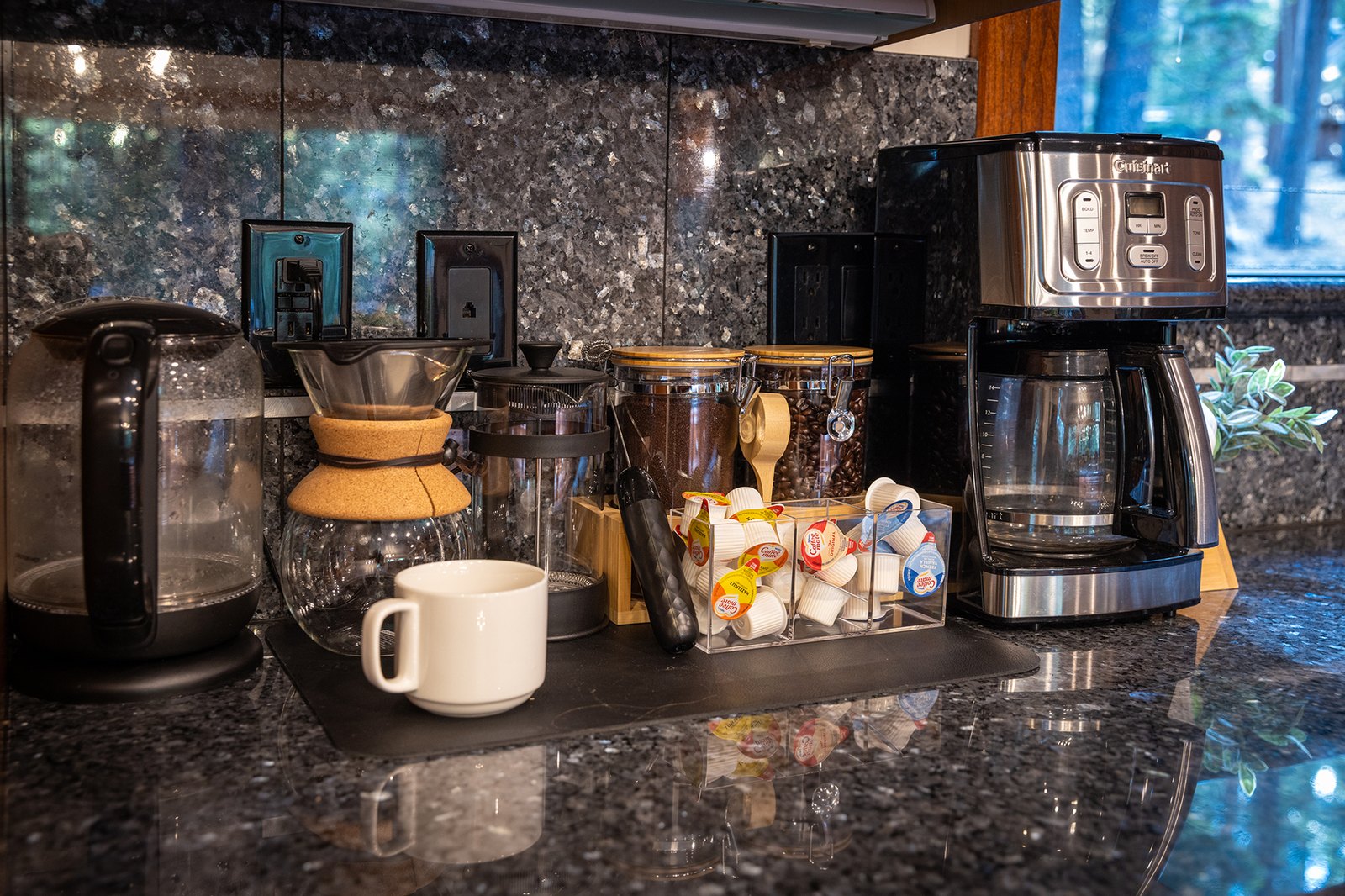 Start slow at the coffee bar — pour-over, drip, or a french press — then take the first cup out to the deck.
