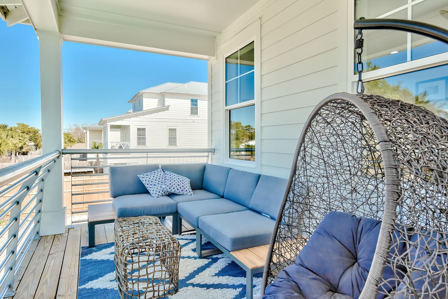 Multiple balconies outfitted with sleek, comfortable furniture