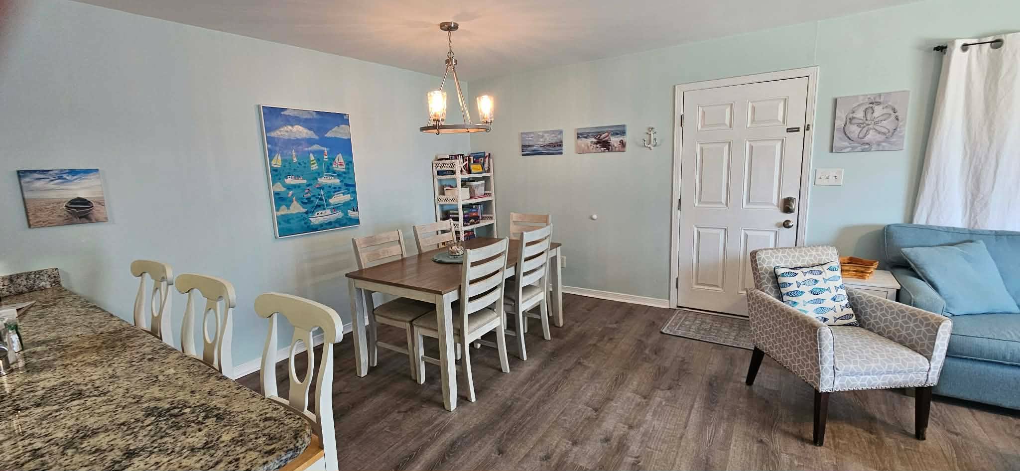 Dining area. 5 seats at the table. 3 seats at the counter bar. 1 highchair if needed is available.