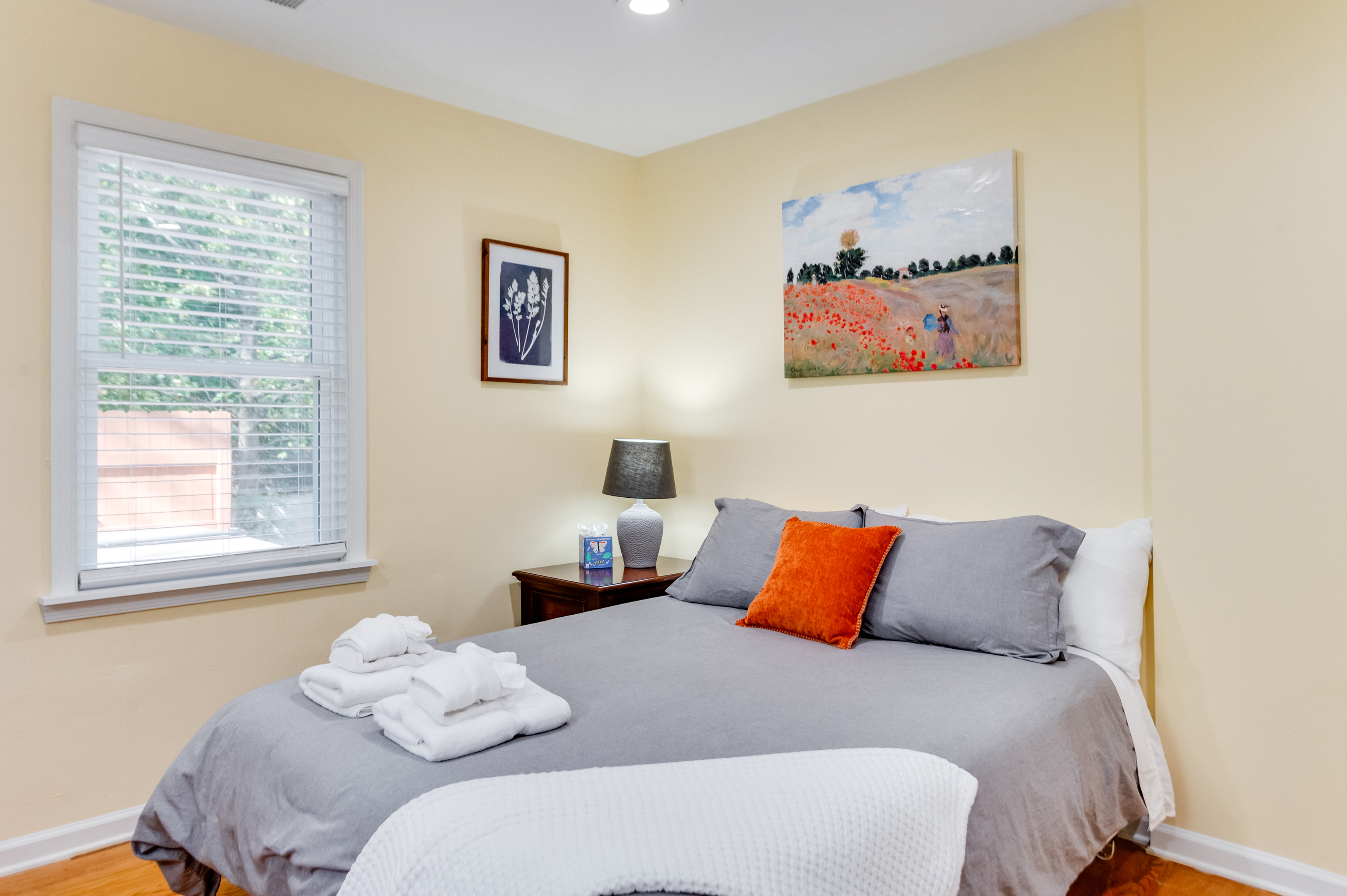Upstairs Queen Bedroom 2: Wake up refreshed in this bright room with artistic decor and cozy linens! 