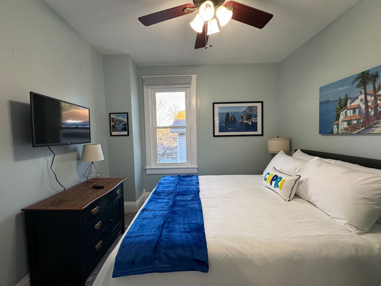 The Capri Room on the Upper Level includes a Queen bed and Roku Smart TV.