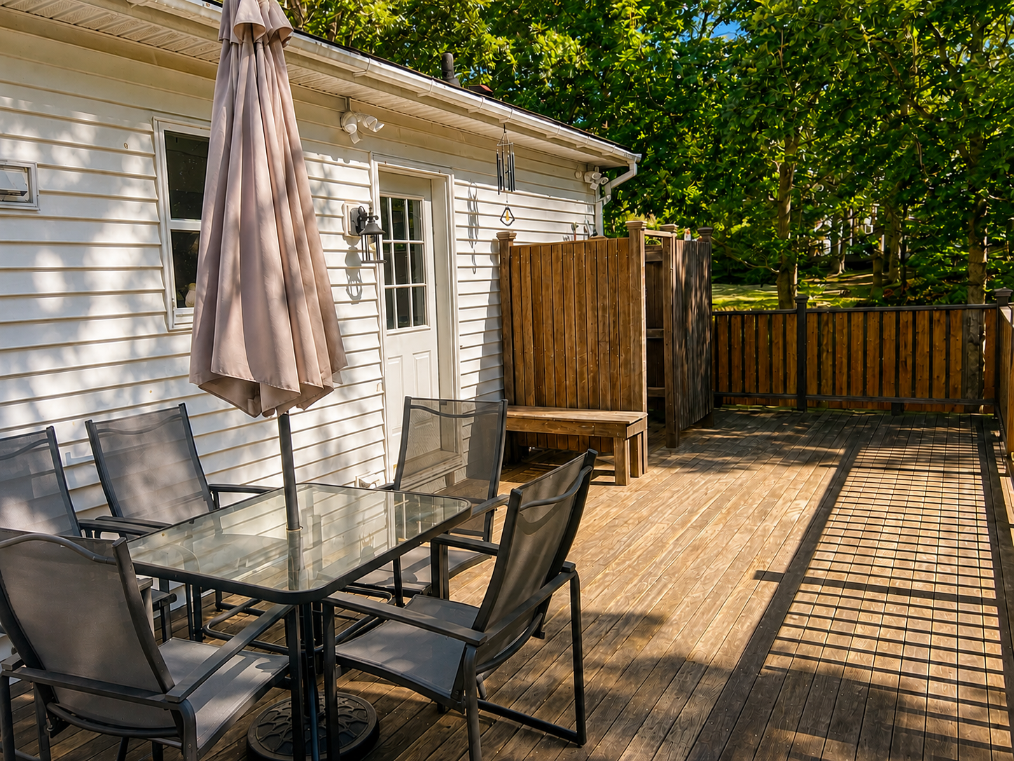 Back deck with outdoor dining and private outdoor shower