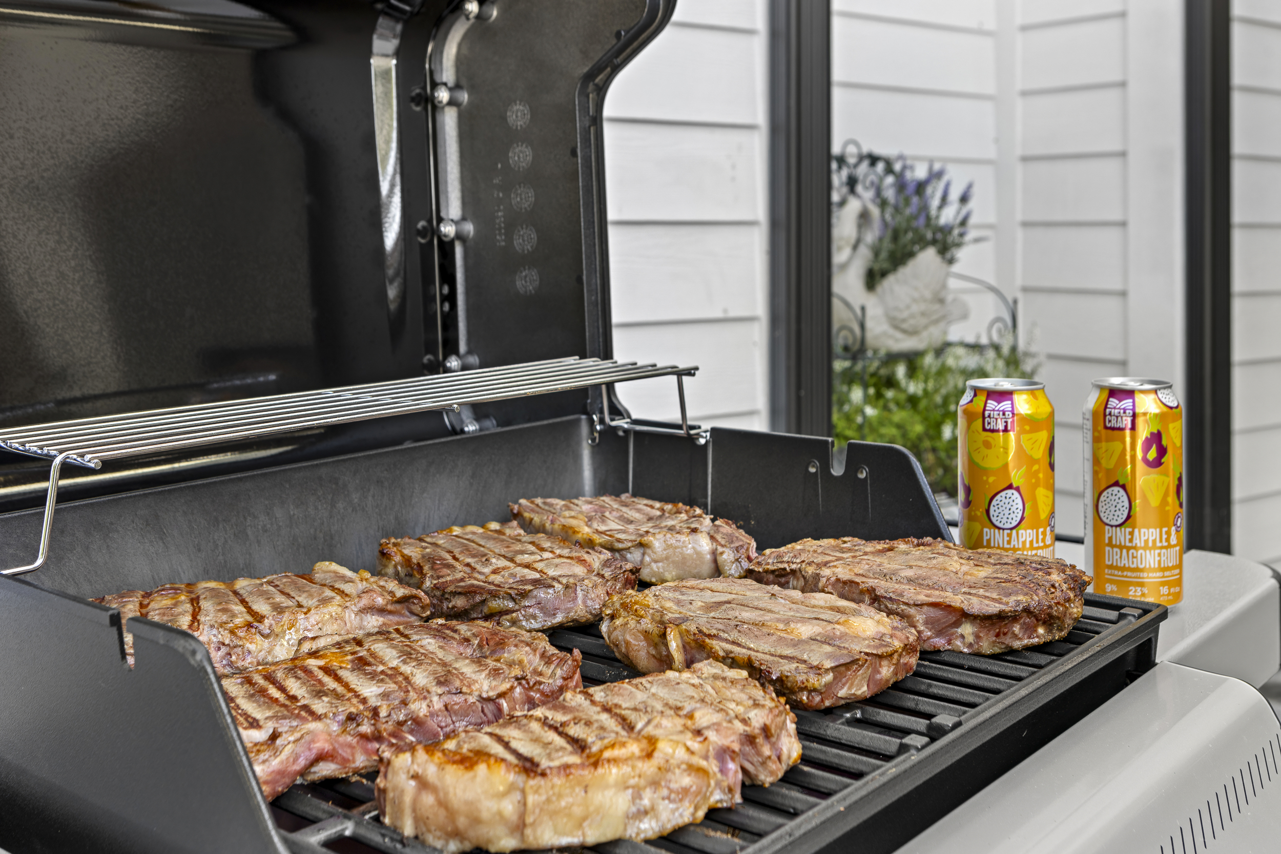 Outdoor Grilling Paradise: Sizzle steaks while enjoying refreshing drinks in lakeside bliss!