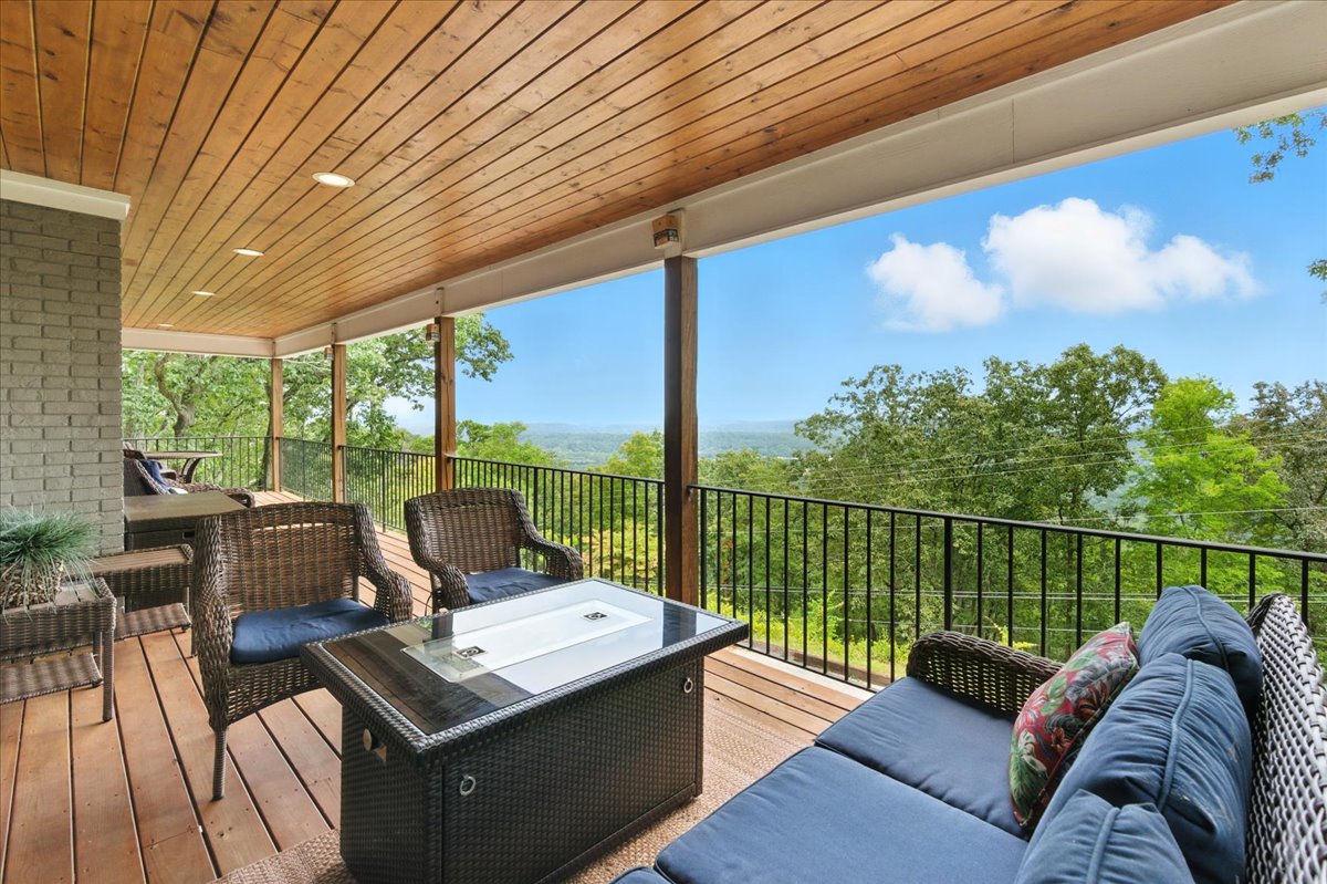 Enjoy the stunning North Georgia mountain views from the large porch, where plenty of comfortable seating awaits