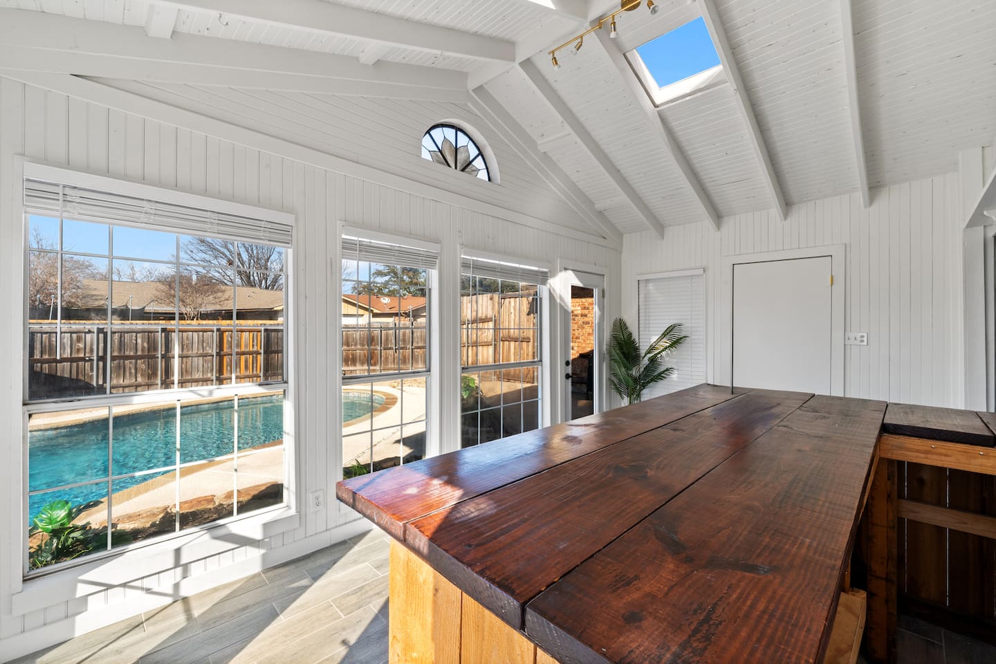 Host happy hour in the sunroom—your private indoor bar with seating for four and classic board games for laid-back fun.