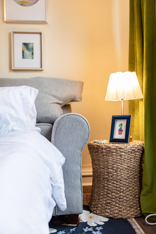 Bright and spacious living room featuring a comfortable sofa bed, perfect for relaxing or accommodating extra guests.