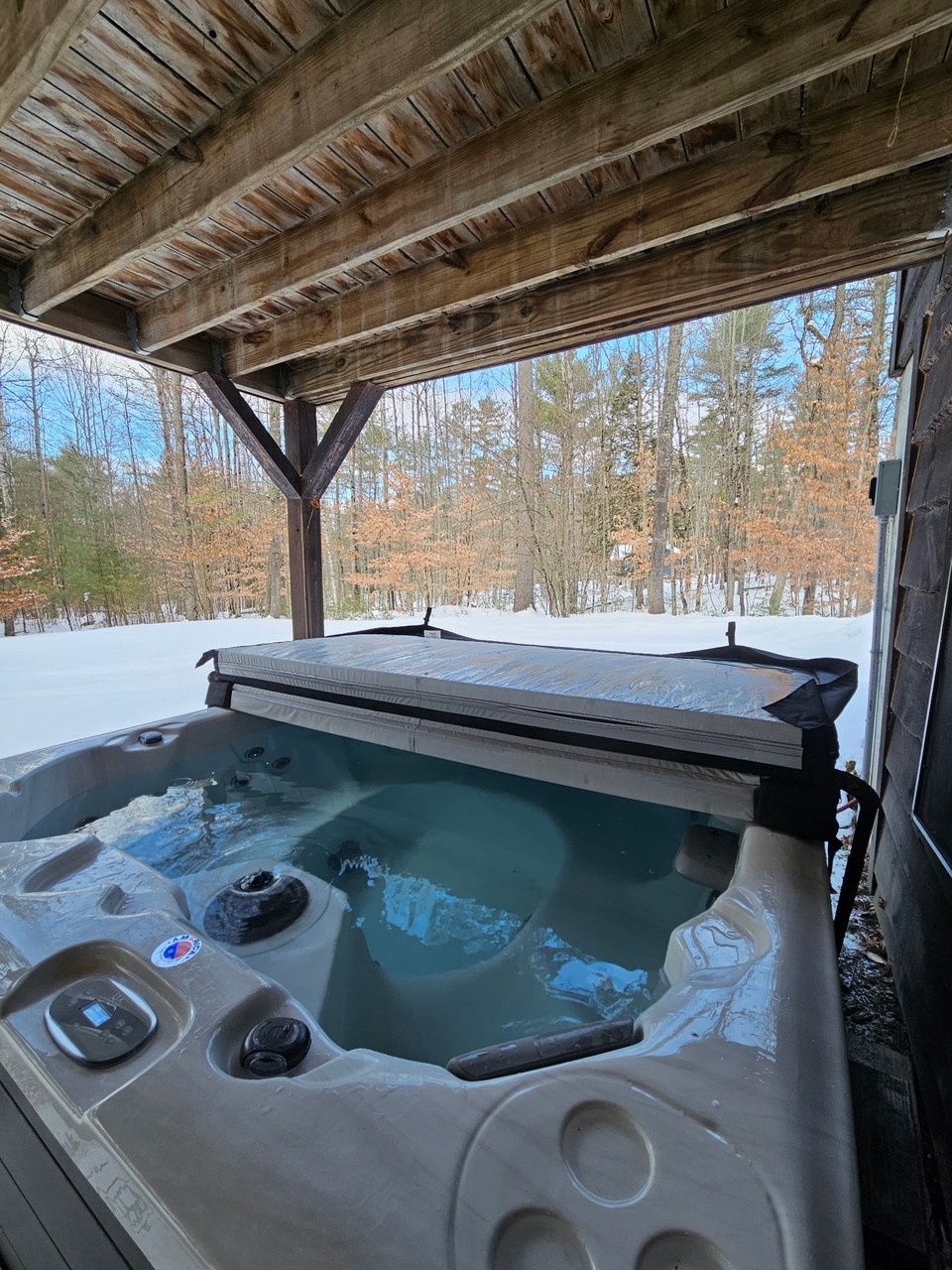 Hot tub beneath covered deck