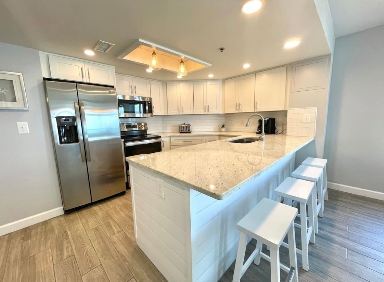 Beautiful remodeled kitchen that is stocked with cooking ware, Keurig, plates, cups, silverware, etc. No Salt/Pepper is provided 