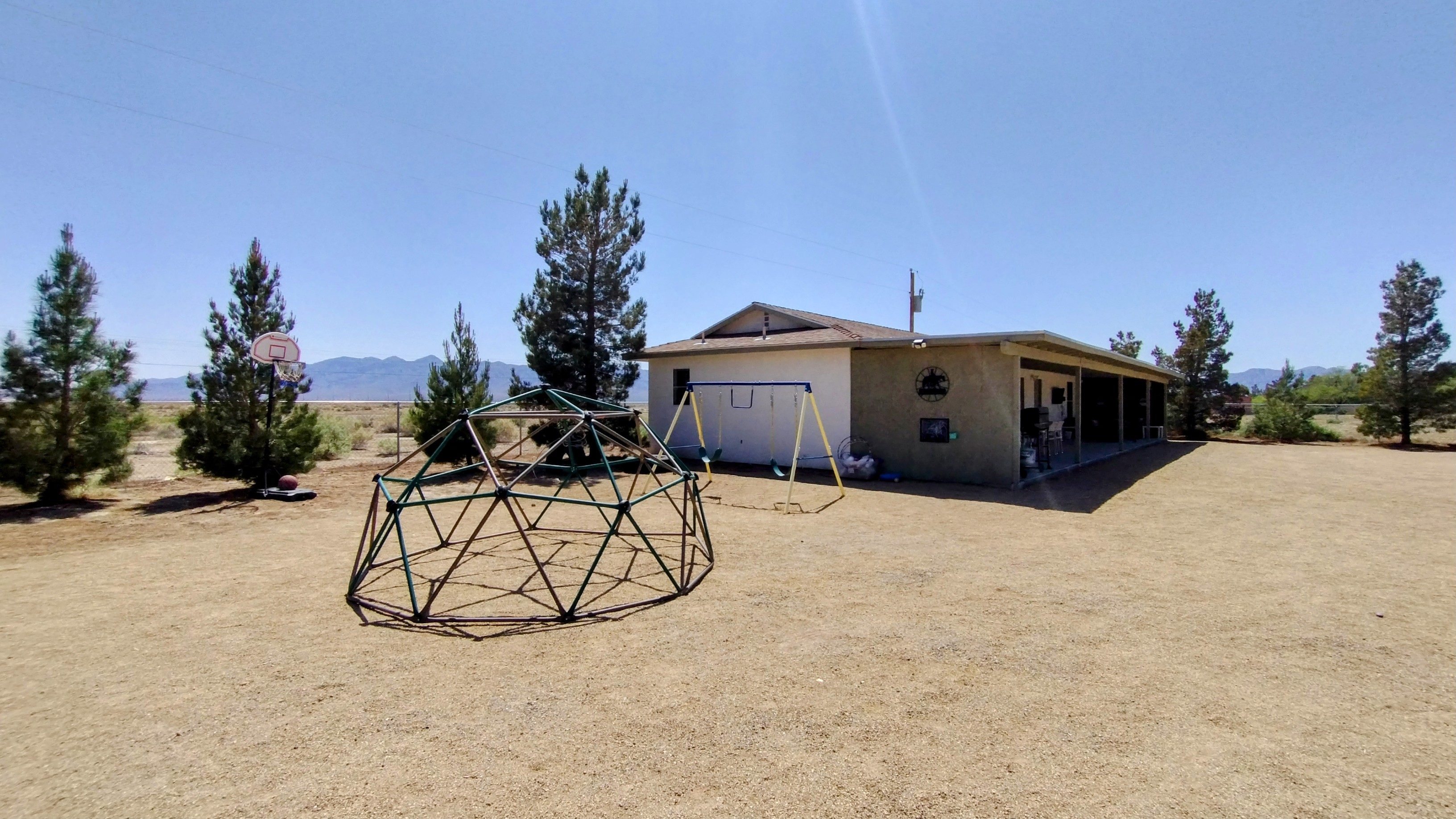 Fun play area for kids with a climbing dome, swings, basketball hoop, chalkboard, cattle roping lasso practice and more!!!