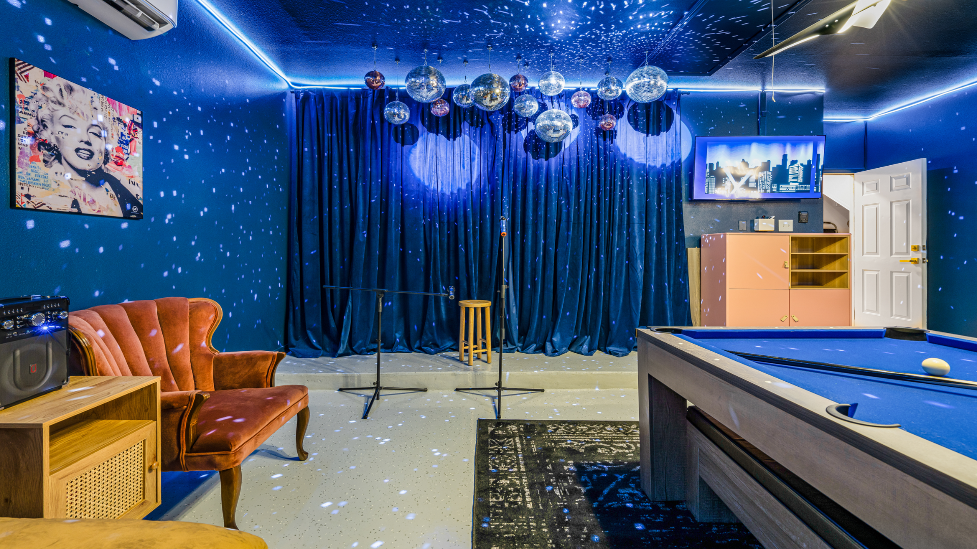 Get ready to shine on this dazzling stage! With sparkling disco balls and mood lighting, this space is perfect for your private karaoke session or live performance. Grab the mic, hit the light