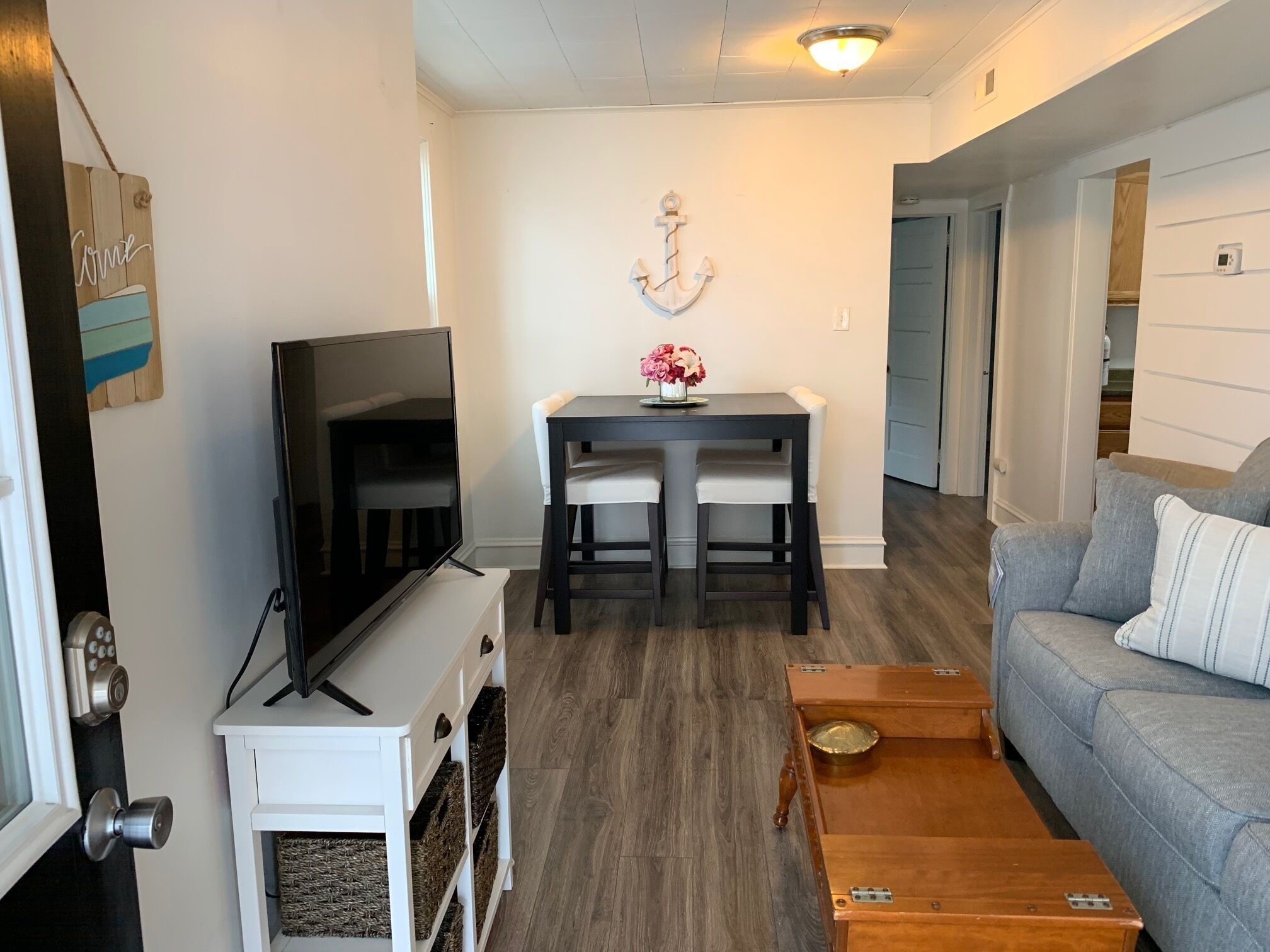 "Cozy and inviting living space with a nautical touch, perfect for relaxing after a day of exploring Ocean City