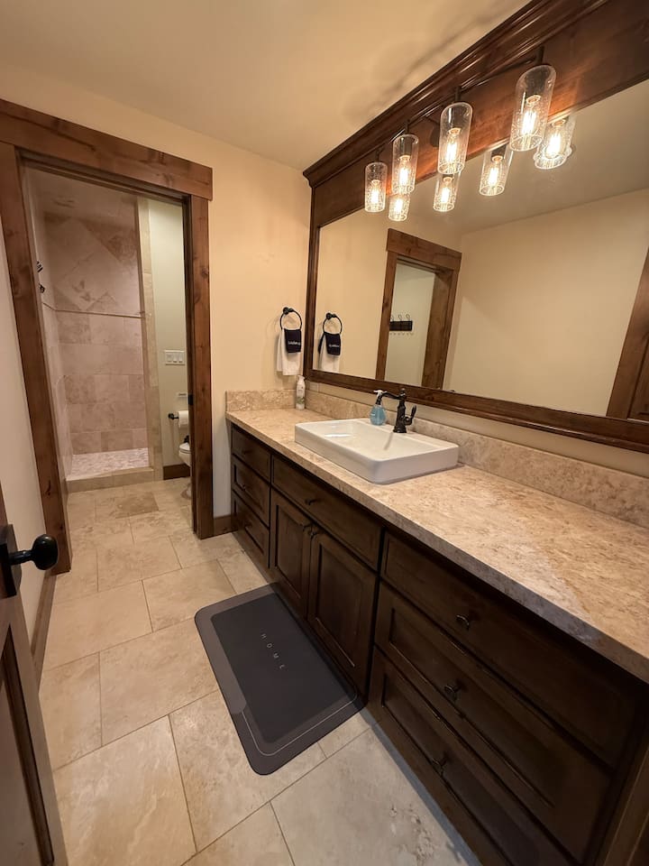 basement bathroom with walk in shower
