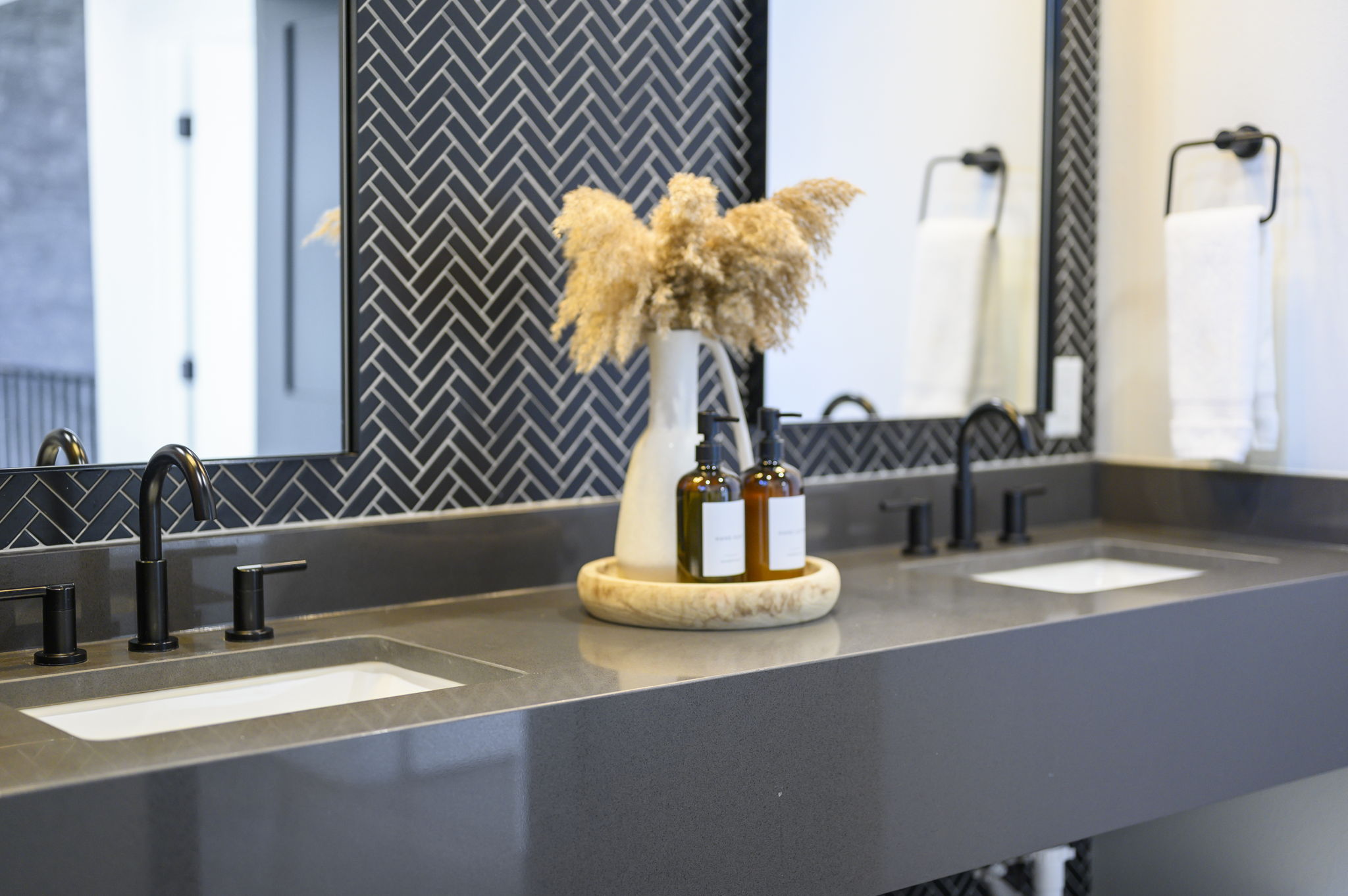 Semi-private bathroom for those staying in the Bunk room. This bathroom features modern teak finishes, stunning modern design, and an oversized rain shower with dual shower heads. 