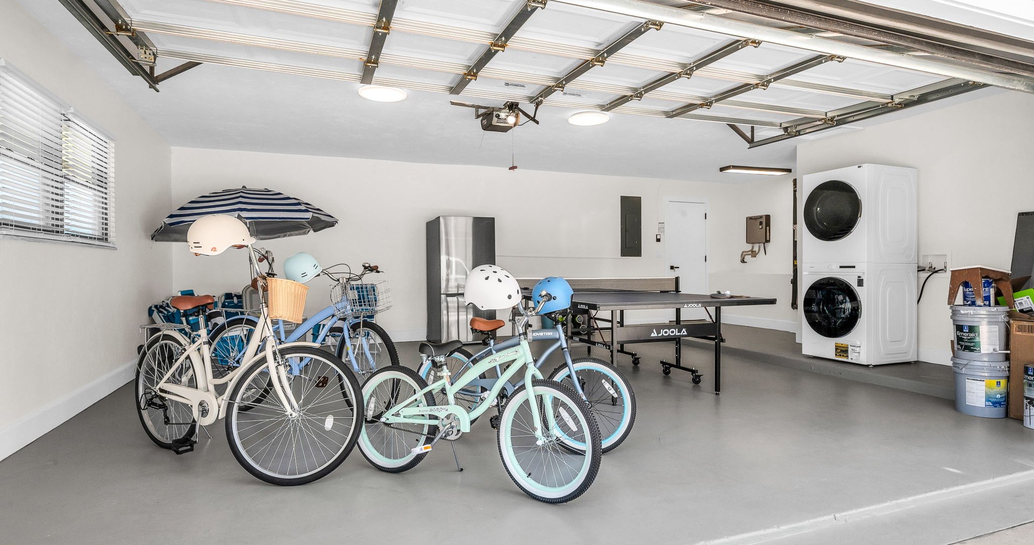 Enjoy a garage filled with extras — from a full-sized Ping Pong table, bikes, and fitness gear to beach chairs, umbrellas, towels, and a cooler — everything you need for fun at home or a perfect day by the water.