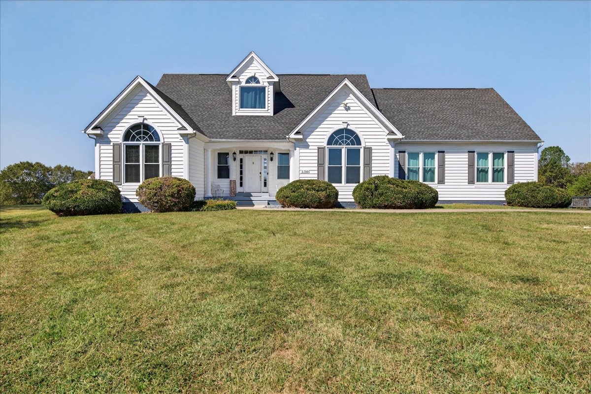Classic lakefront style located in a cul-de-sac with paved driveway.