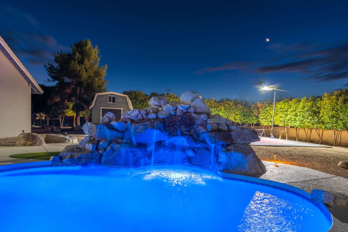 Twinkling lights and soft blue hues set the tone for unforgettable nights by the water.

