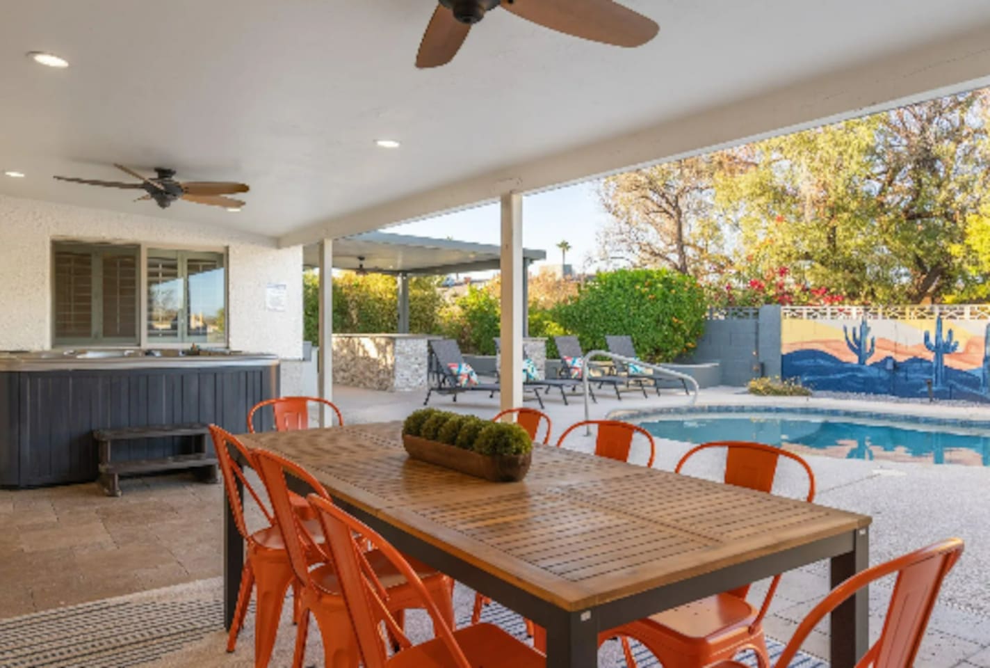 A shaded dining table seats the whole group right poolside, so meals never mean stepping away from the fun.