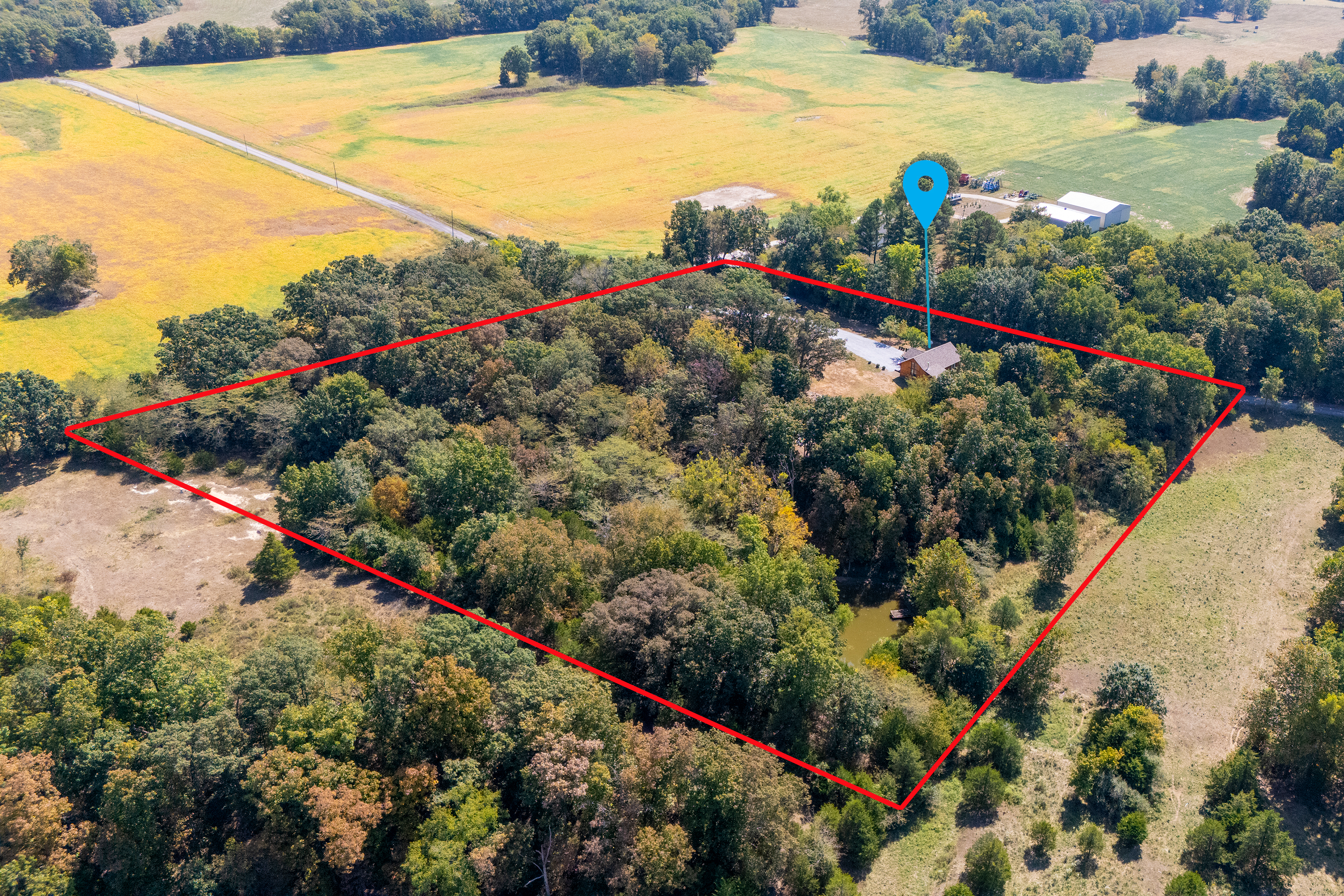 Aerial view showcasing 7 private acres of peaceful Southern Illinois countryside.