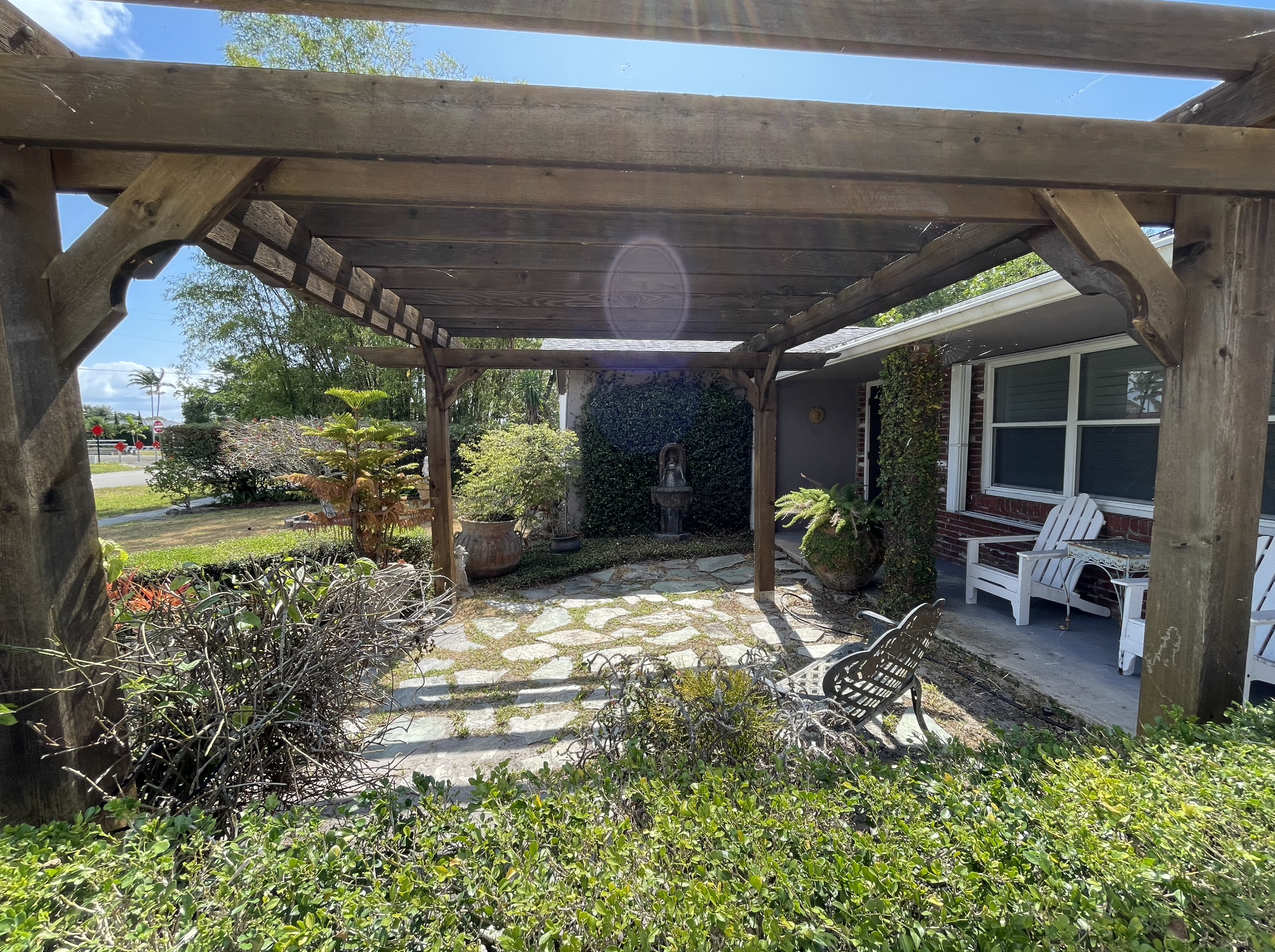 Enjoy time outside under the pergola, surrounded by a garden and fountains.