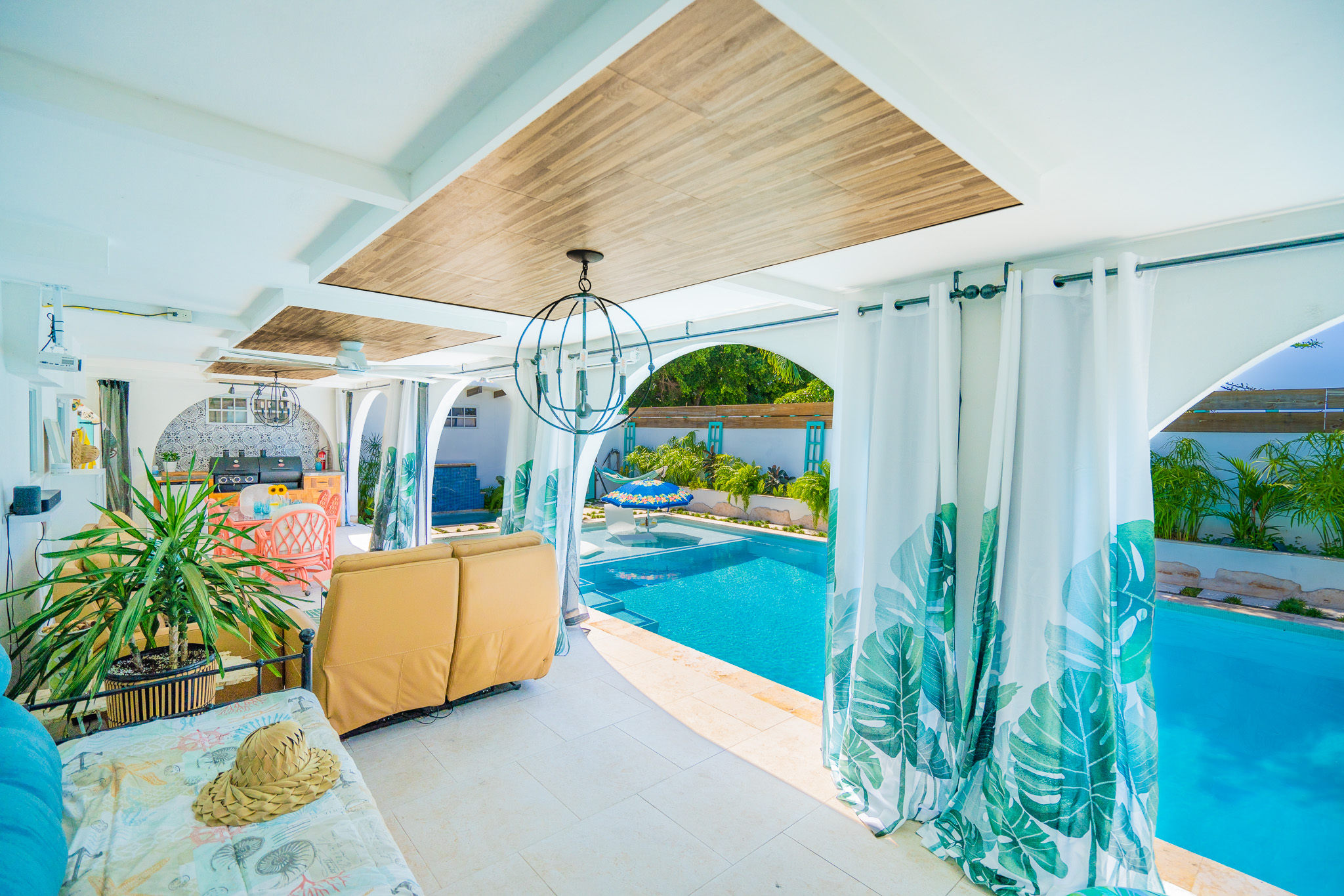 Long View of patio from cabana bath to al fresco dinner, to movie nights in Dorado, Puerto Rico.