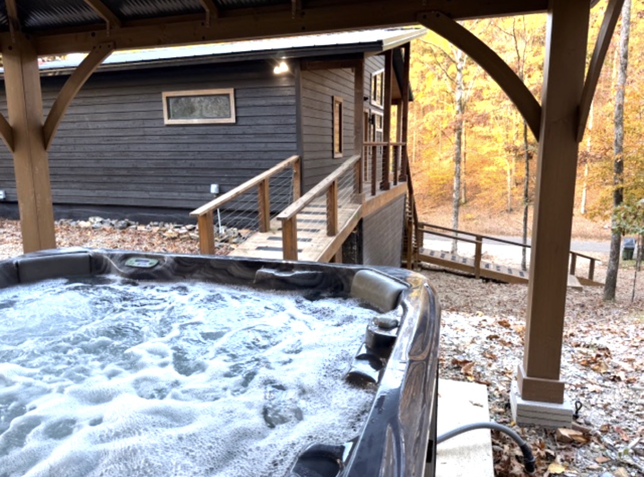 Your own secluded hot tub retreat, just steps from the cabin — warm, peaceful, and wrapped in nature