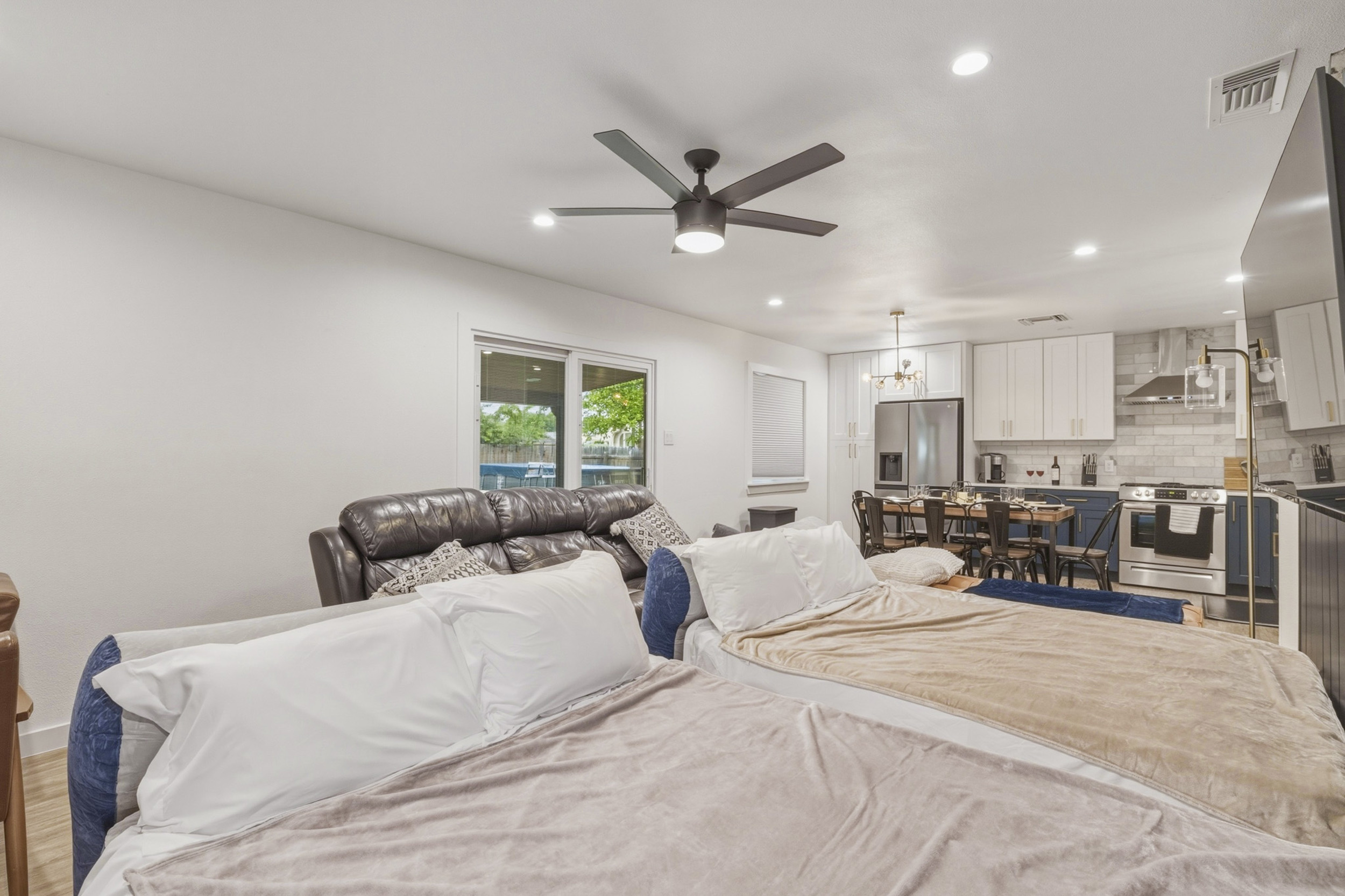 Bright and airy space for relaxation, featuring plush seating and a stylish dining area!