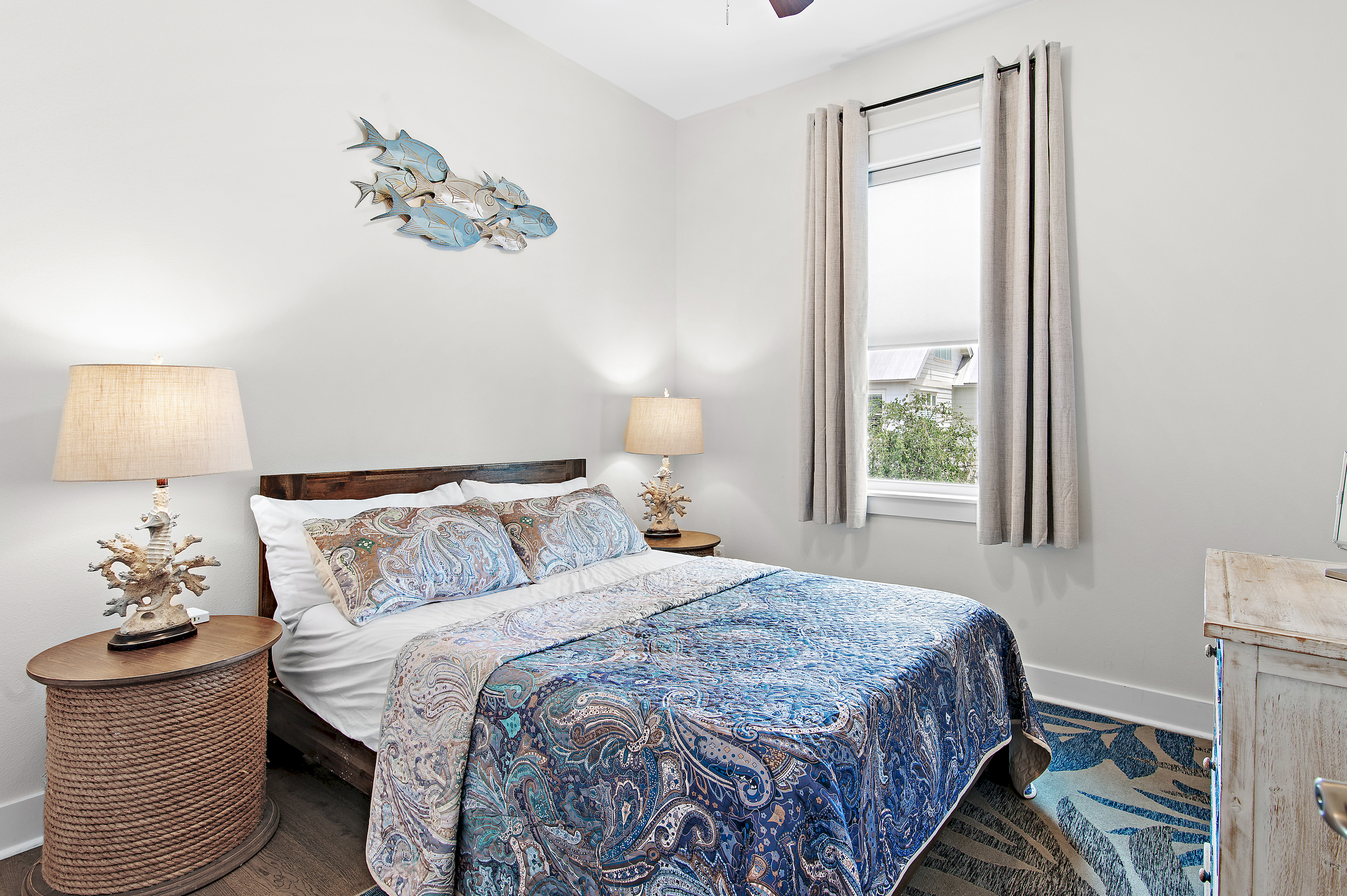 Bright and comfortable guest bedroom designed for a restful stay, featuring cozy bedding and plenty of space to unpack and relax.