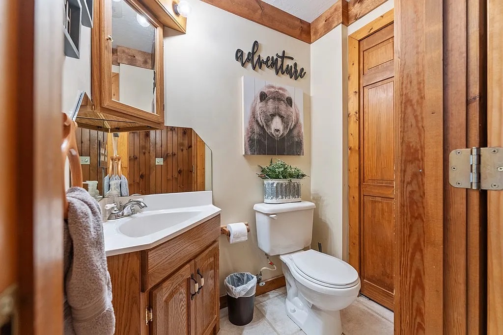 Upstairs half bath with sink and toilet