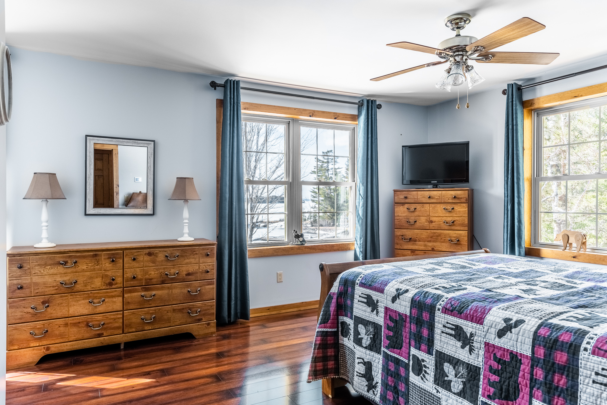 Upstairs bedroom with a queen bed overlooking the lake