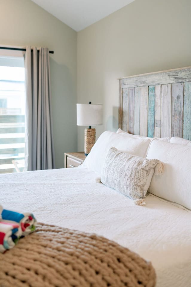 A cozy and inviting bedroom designed for restful nights after beach days.