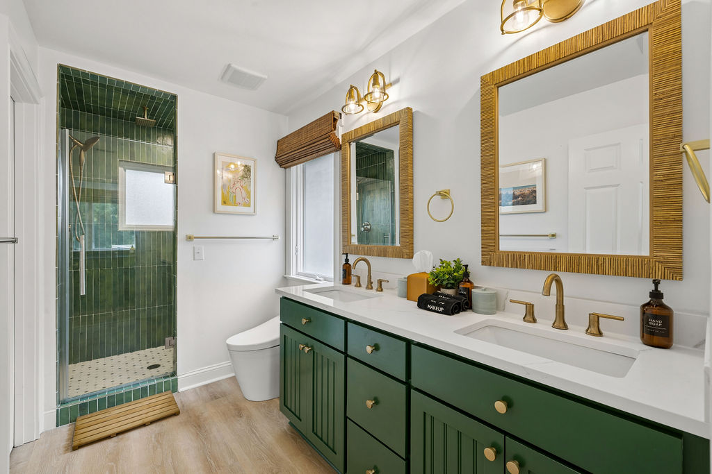 Ensuite bathroom featuring double vanity and walk-in steam shower