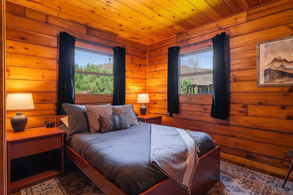 Unwind in the peaceful master bedroom with a full-size bed and a 43" smart TV for late-night movies or morning news.