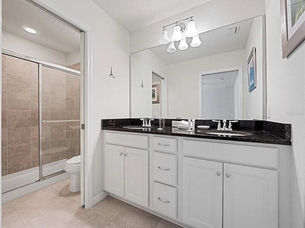 Beautiful ensuite bath with separate shower and toilet for added privacy
