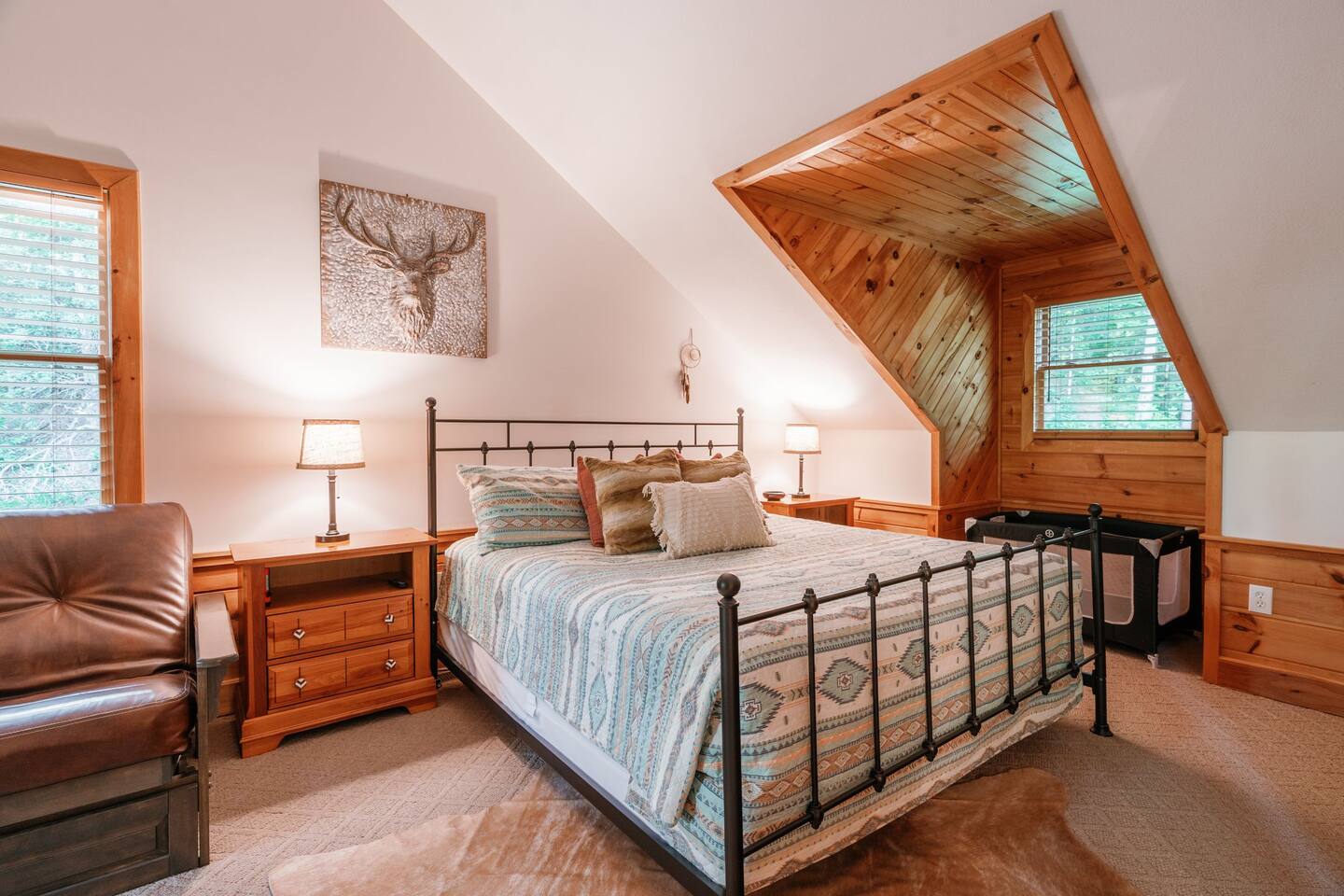 King Bed with queen size sleeper sofa. Pack and play and high chair for babies stored in this bedroom's closet.