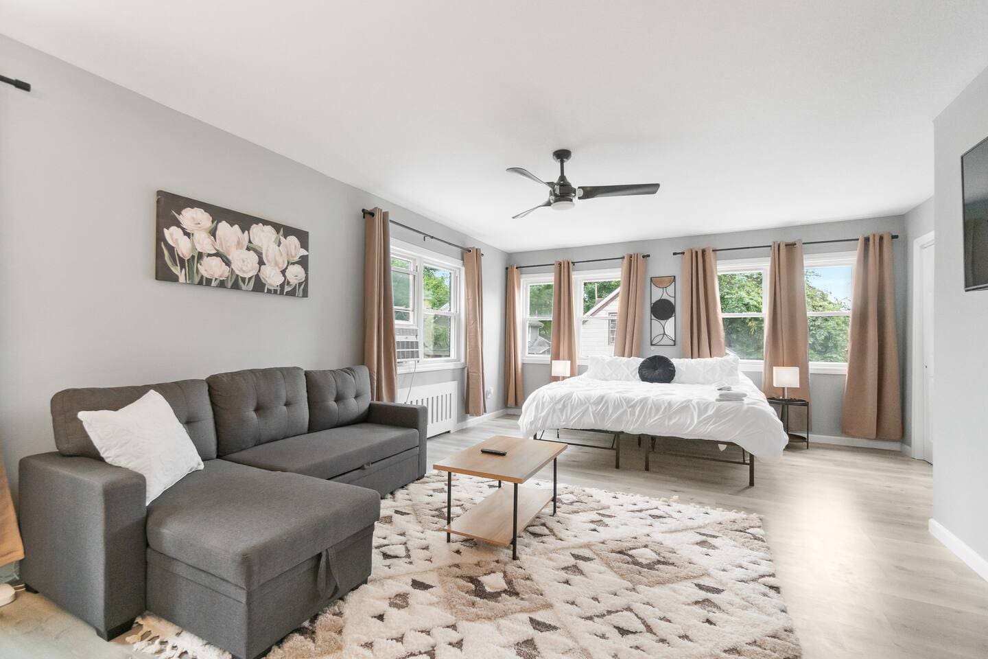 Open living and bedroom area, seamlessly blending comfort and style for a relaxed, inviting space.